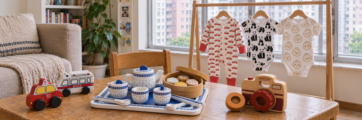 Thorn and Burrow Taxi sleepsuit, Panda and Dumpling onesies alongside wooden toys in a Hong Kong family home.