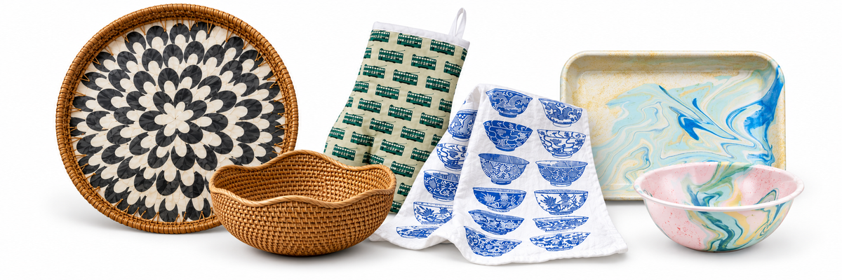 Kitchenware white collage with inlaid rattan tray, basket, tram oven mitt, bowls tea towel and marbled enamel bowl and tray