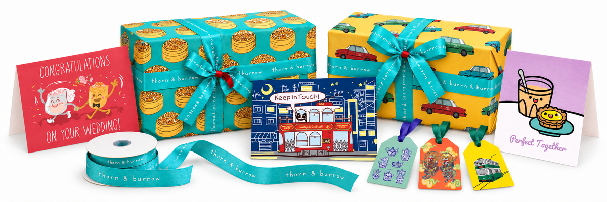 Thorn and Burrow gift wrap, branded ribbon, three different greeting cards and illustrated gift tags on white