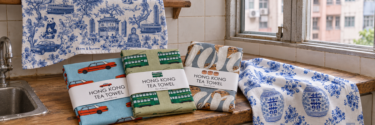 Thorn and Burrow Taxi, Tram, Siu Mai, Chinoiserie and Ginger Jar tea towels in a Hong Kong kitchen