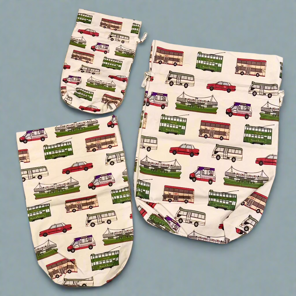 Three reusable Hong Kong gift bags in small, medium and large sizes with red taxis, trams, buses and Star Ferry prints.