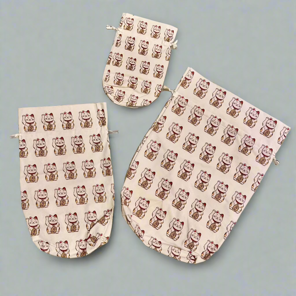 Small, medium and large cotton gift bags printed with Hong Kong lucky cats.