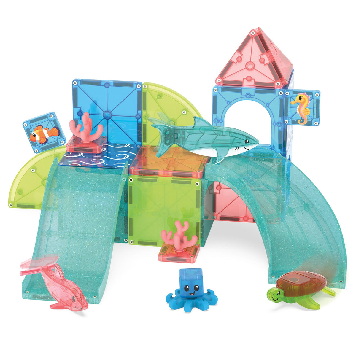 Angled front view of Coral Reef 25-piece magnetic set showing translucent coral tiles, curved wave panels and ocean animal figures on white